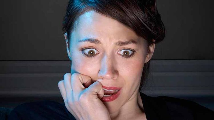Worried woman looking at Facebook image sizes